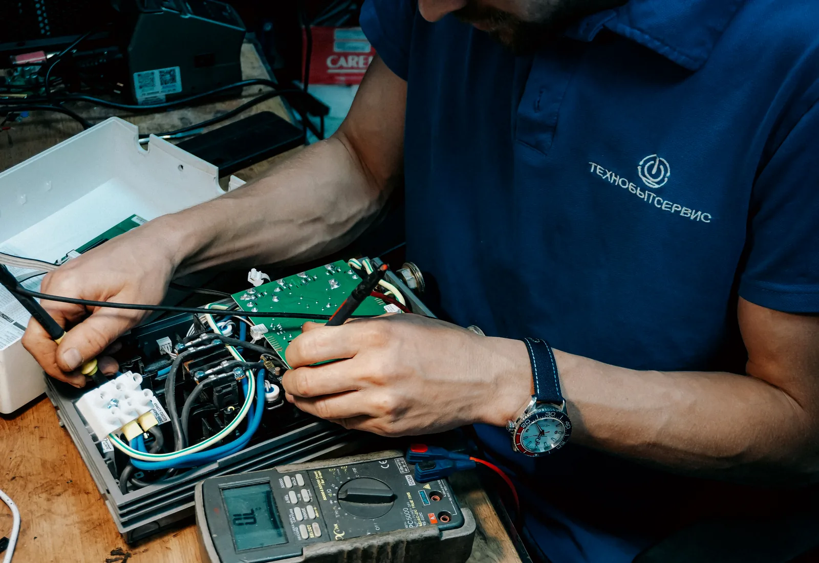 Technician testing electronic components
