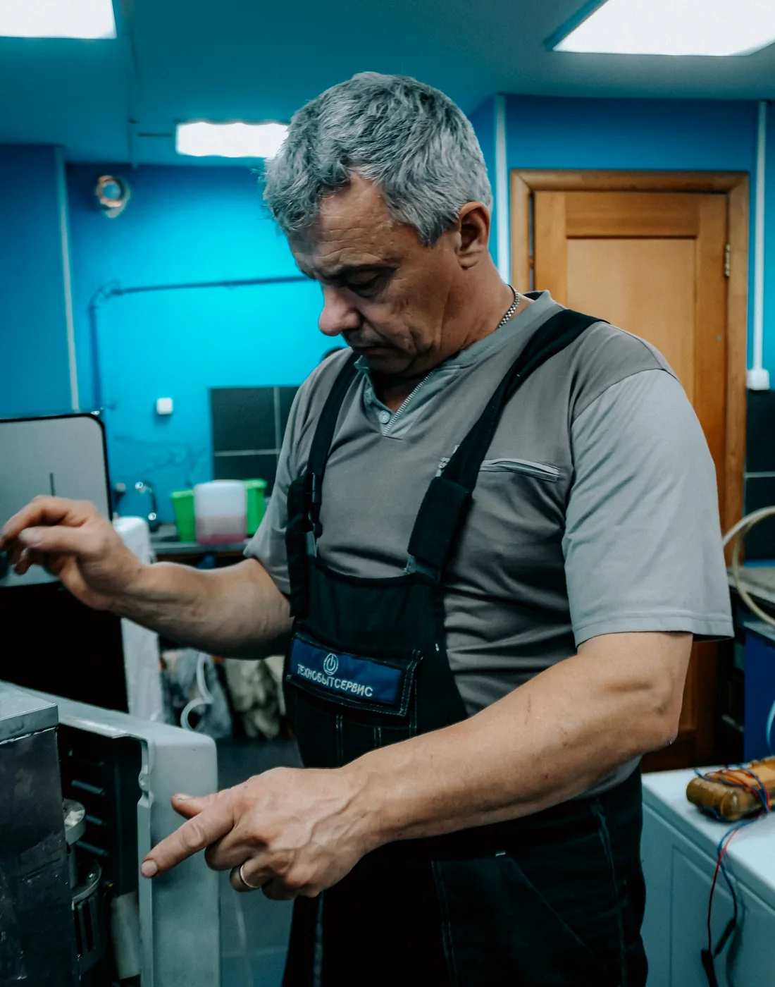 Appliance technician working carefully